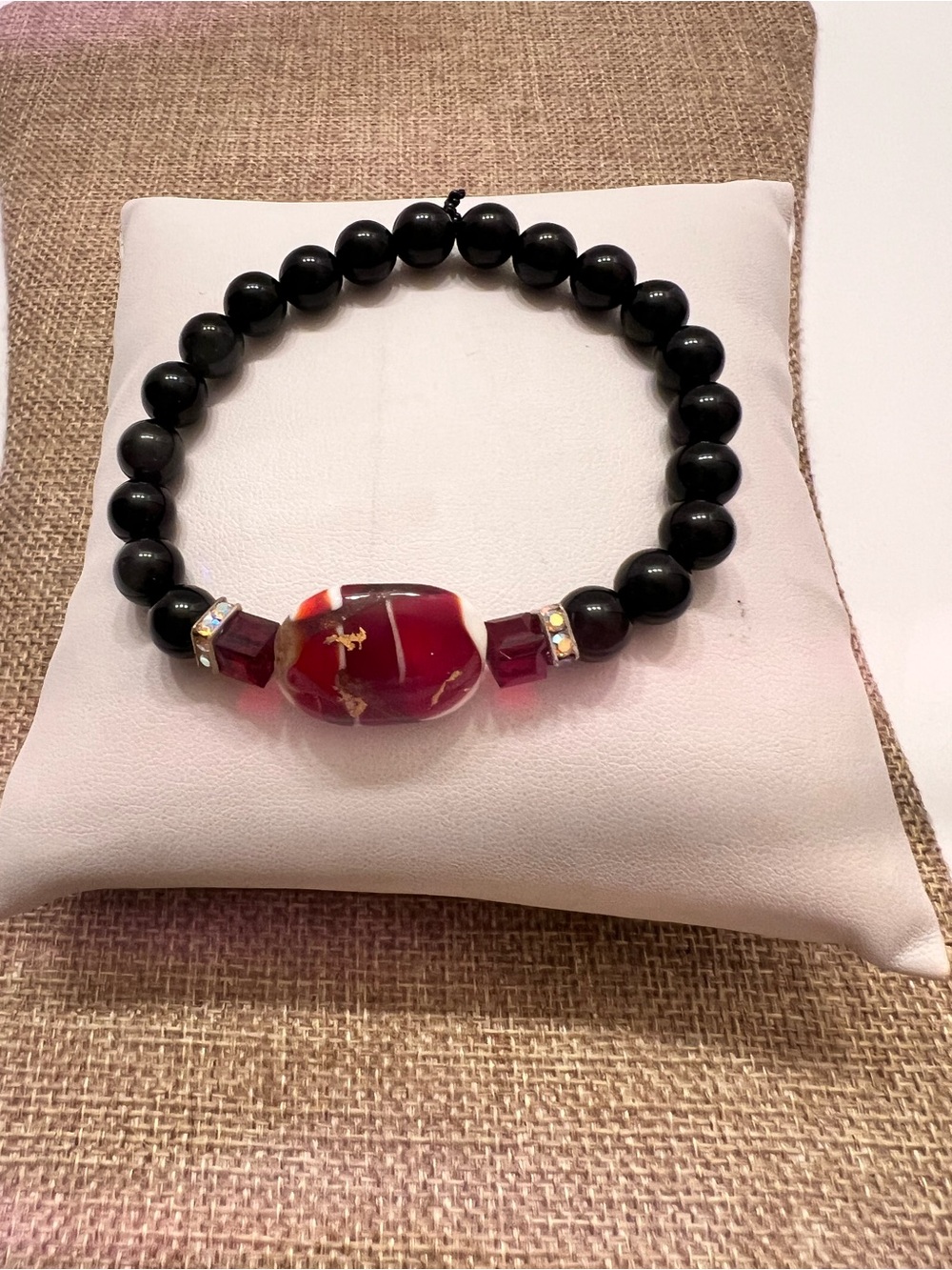 Elegant Black Beaded Bracelet with Red Agate Center